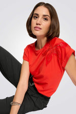 טישירט עיטור רקמת פרח מנצנץ בצבע כתום