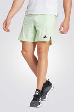 מכנסיים קצרים לגברים DESIGNED FOR TRAINING בצבע ירוק זוהר