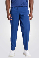 מכנסיים ארוכים לגברים TRAIN ESSENTIALS WOVEN בצבע כחול
