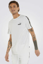 PUMA - טישירט לגבר ESS+ Tape Tee בצבע לבן - MASHBIR//365