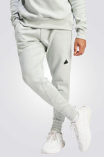 ADIDAS - מכנסיים ארוכים לגברים Z.N.E. PREMIUM בצבע לבן - MASHBIR//365