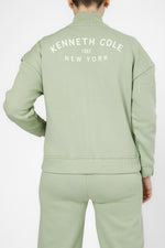 סווטשירט עם רוכסן לוגו בגב בצבע ירוק