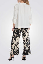 מכנסיים ארוכים הדפס עלים בצבע שחור/שמנת