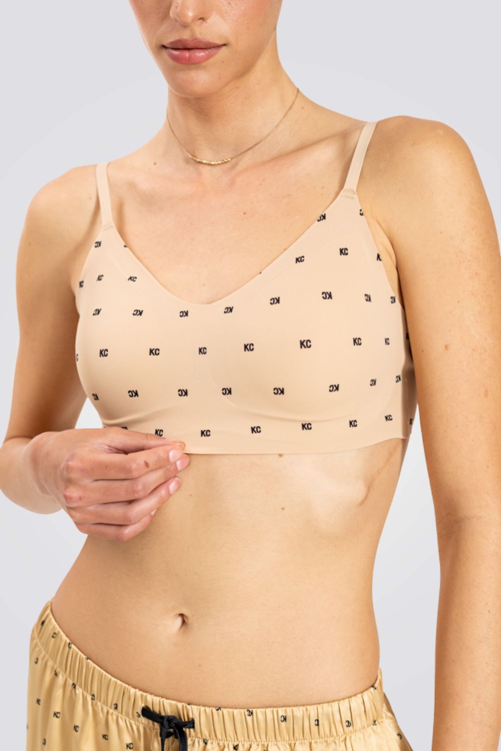 טופ משולשים לייזר קאט מונוגרם בצבע ניוד