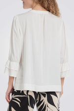 חולצה עם שרוולי מלמלה בצבע לבן