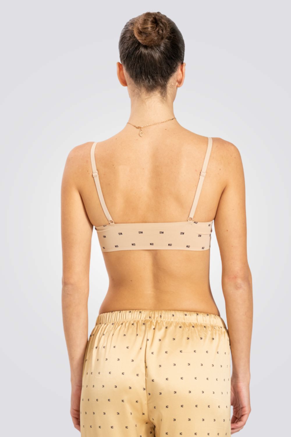 טופ משולשים לייזר קאט מונוגרם בצבע ניוד