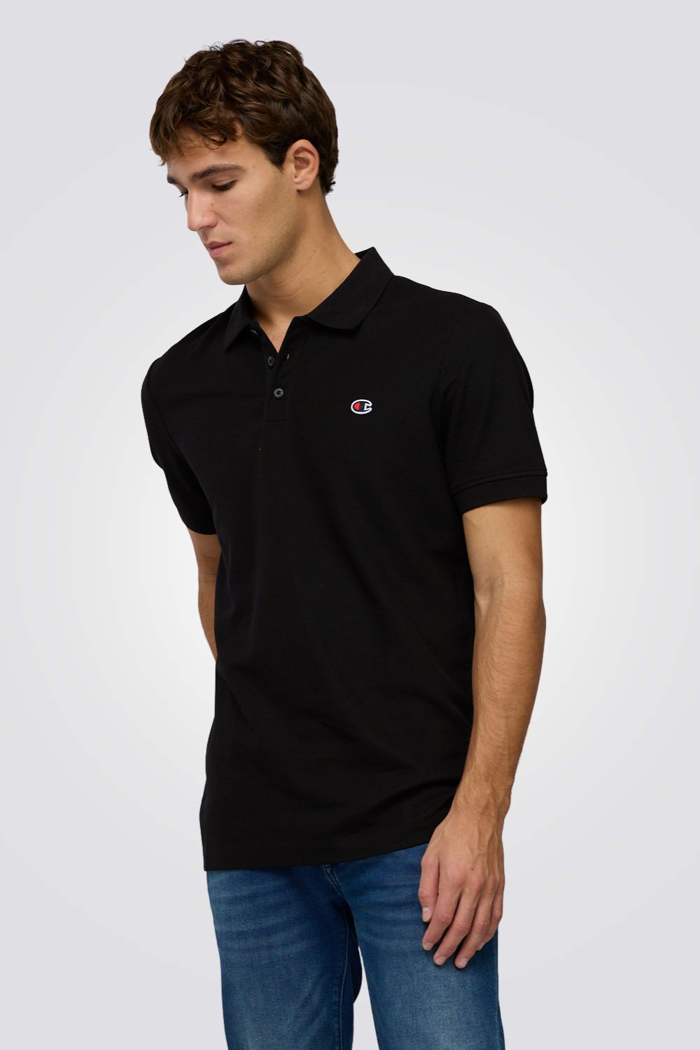 חולצת פולו שחורה עם לוגו | צ'מפיון 
