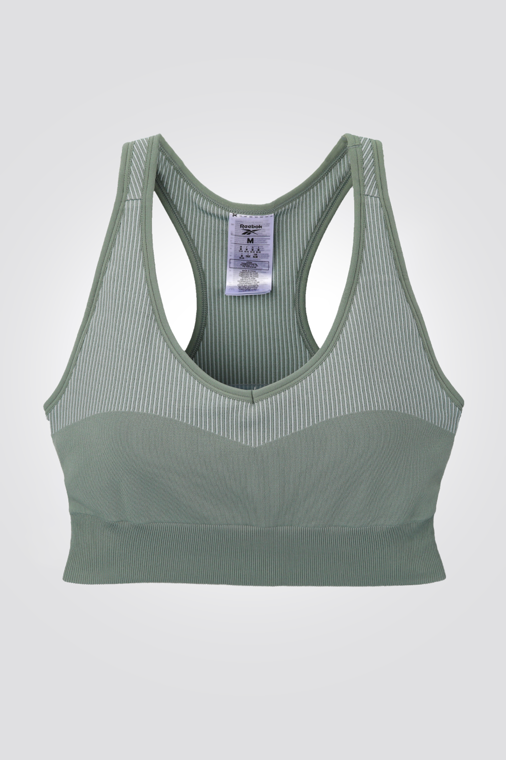 טופ מבית המותג REEBOK, בד נמתך שמאפשר תנועה חופשית . רפידות נשלפות להתאמה מושלמת