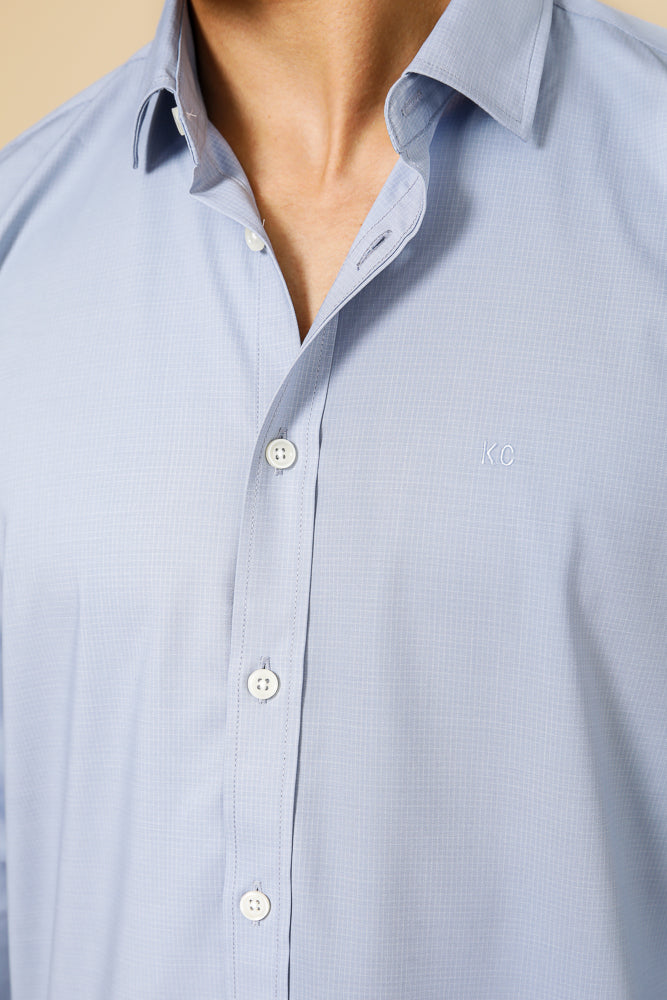 מכופתרת במבוק טקסטורה בצבע כחול