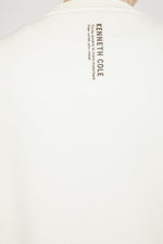 סווטשירט אוברסייז סיומת אלסטית בצבע שמנת