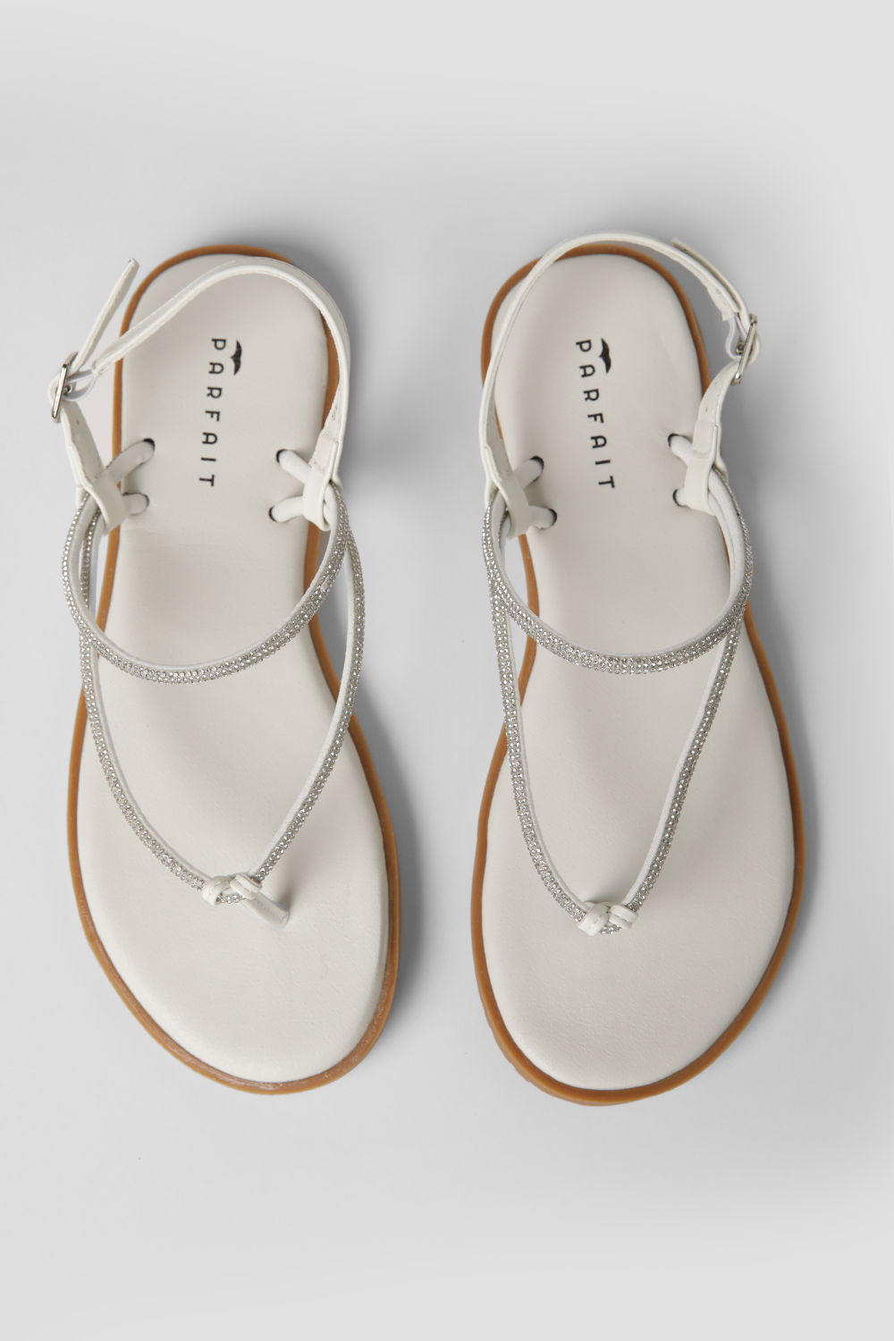 סנדלי אצבע לנשים בצבע לבן