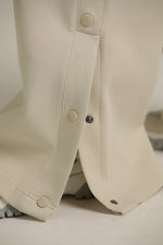 מכנסי טרנינג רחבים עם כפתורים בצד | קנת קול