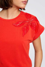 טישירט עיטור רקמת פרח מנצנץ בצבע כתום