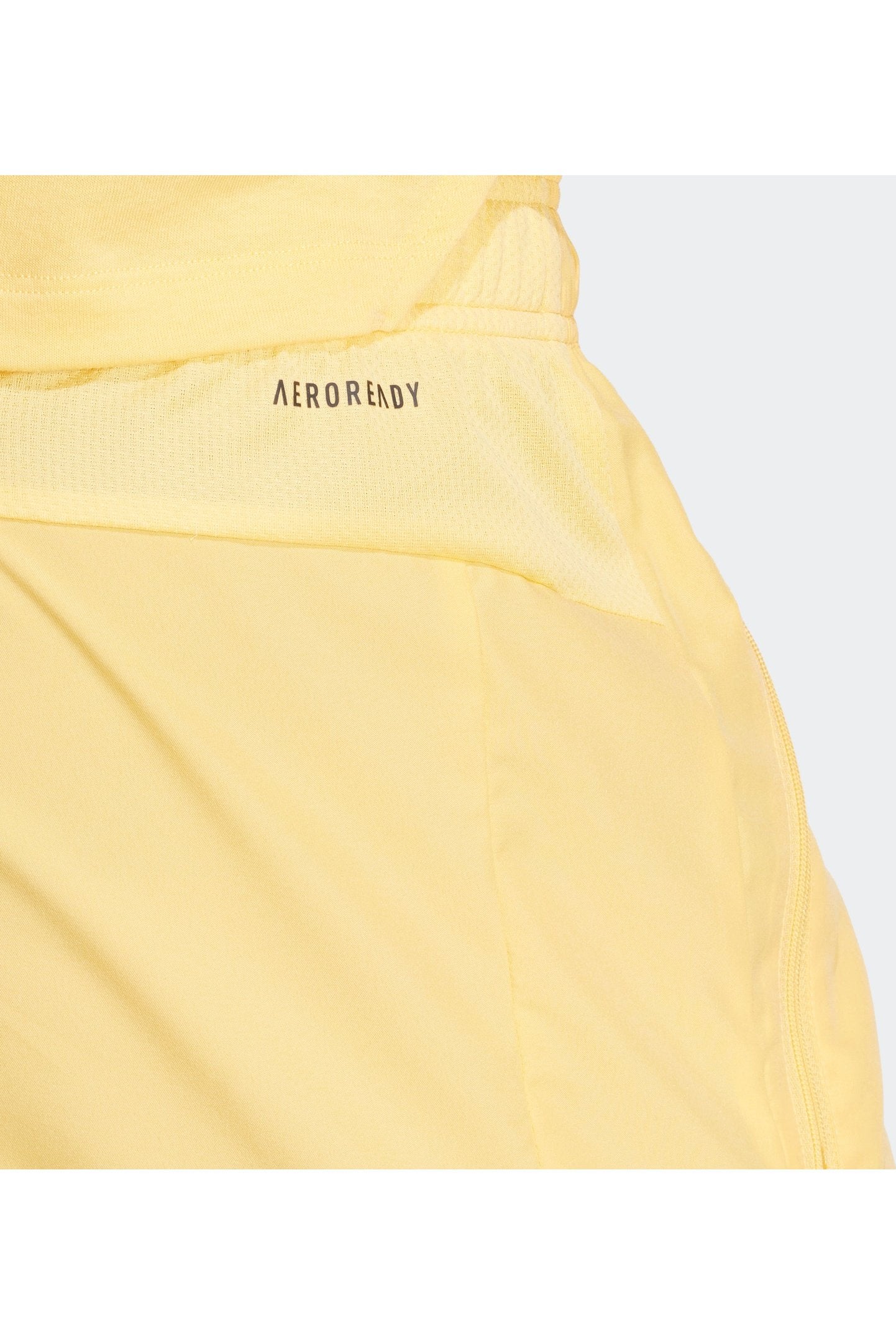 מכנסיים קצרים לנשים TRAIN ESSENTIALS WOVEN בצבע צהוב