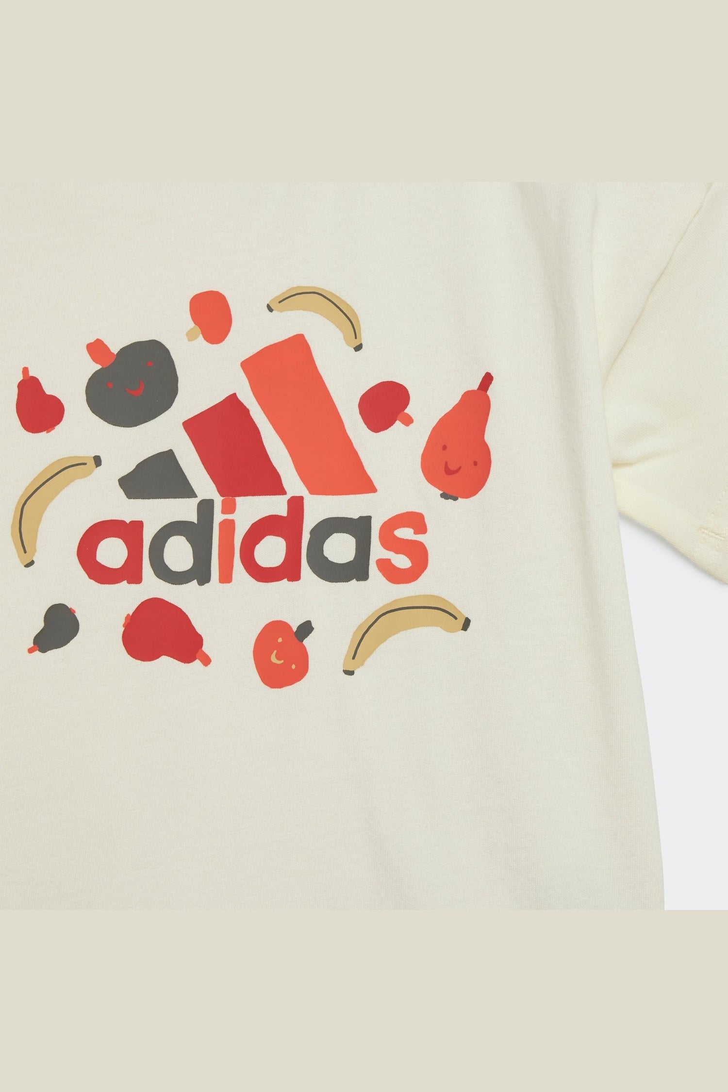 חליפה לילדות ESSENTIALS ALLOVER PRINT בצבע קרם וכתום