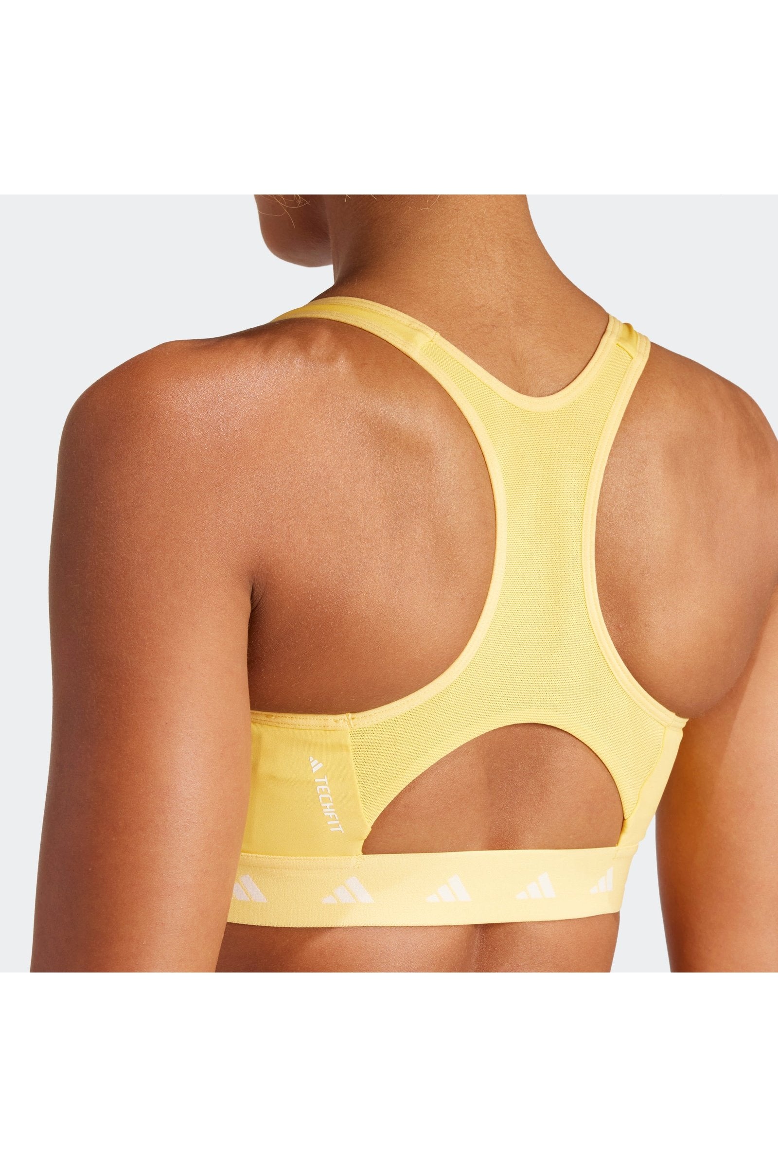 טופ אימון לנשים POWERREACT TRAINING MEDIUM-SUPPORT TECHFIT בצבע צהוב ולבן