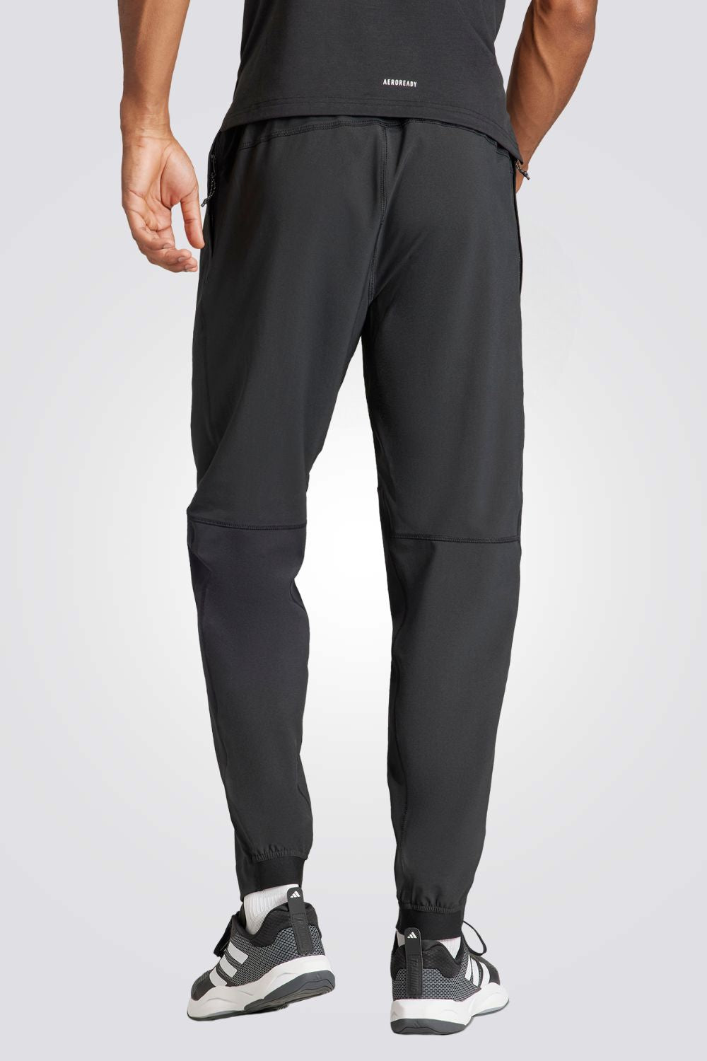 מכנסיים ארוכים לגברים TRAIN ESSENTIALS WOVEN בצבע שחור