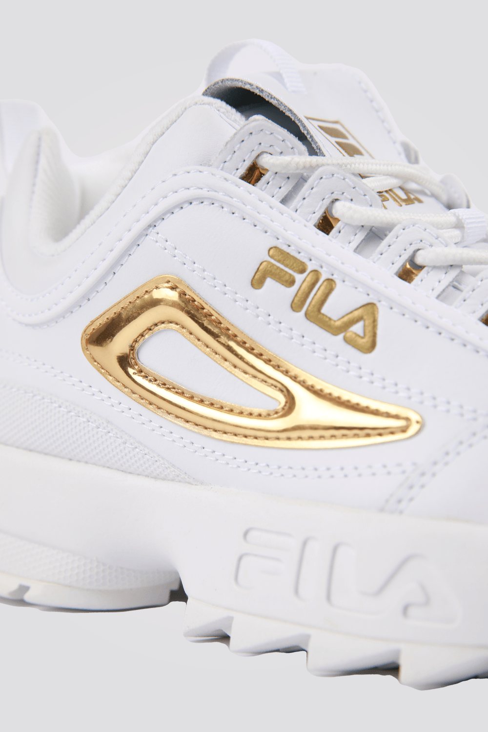 סניקרס לנשים בצבעים לבן וזהב | פילה