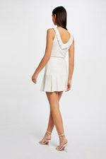 MORGAN - חצאית קצרה עם קפלים בצבע לבן - MASHBIR//365