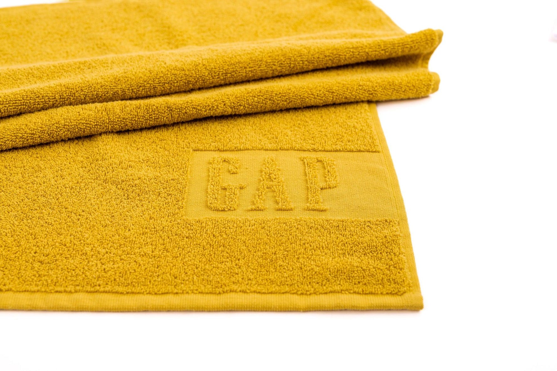 GAP - מגבת גוף כותנה בגוון חרדל - MASHBIR//365