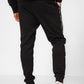 KENNETH COLE - מכנסי טרנינג עם פס כיתוב לוגו בצבע שחור - MASHBIR//365 - 2