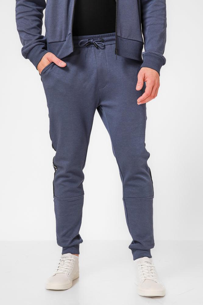 KENNETH COLE - מכנסי טרנינג עם פס כיתוב לוגו בצבע כחול - MASHBIR//365