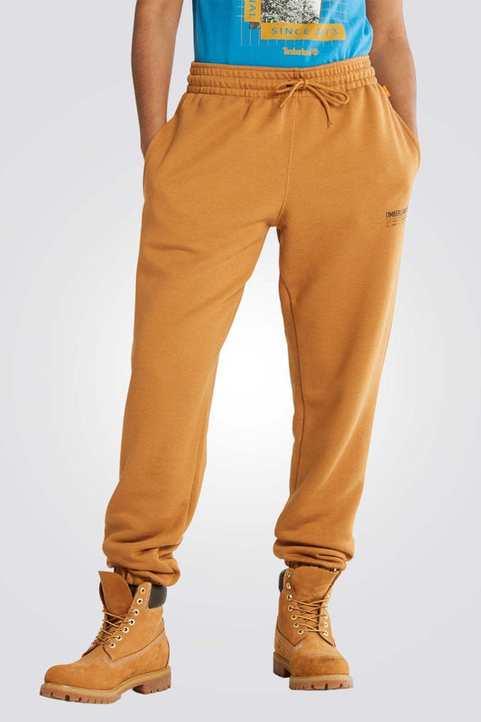 TIMBERLAND - מכנסי טרנינג עם הדפס לוגו צבע חרדל - MASHBIR//365