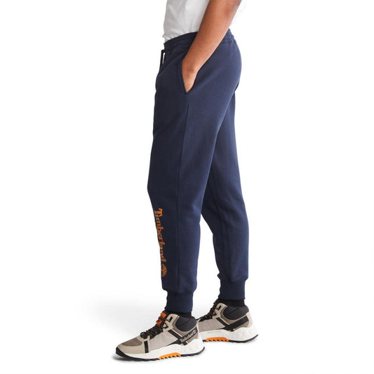 TIMBERLAND - מכנסי טרנינג עם הדפס לוגו המותג על הרגל בתחתית - MASHBIR//365