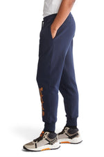 TIMBERLAND - מכנסי טרנינג עם הדפס לוגו המותג על הרגל בתחתית - MASHBIR//365