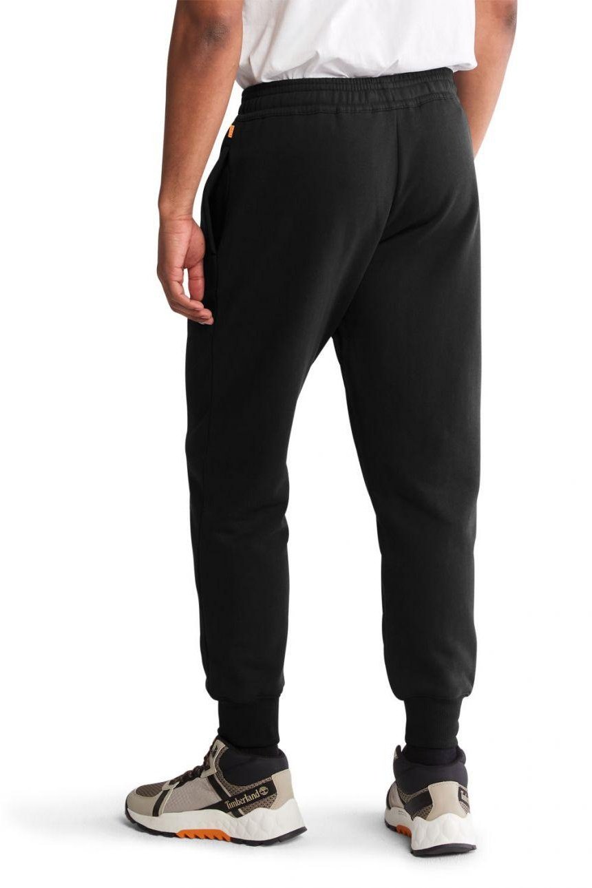 TIMBERLAND - מכנסי טרנינג עם הדפס לוגו המותג על הרגל בתחתית - MASHBIR//365