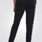 UNDER ARMOUR - מכנסי ספורט ארוכים לנשים בצבע שחור - MASHBIR//365 - 3