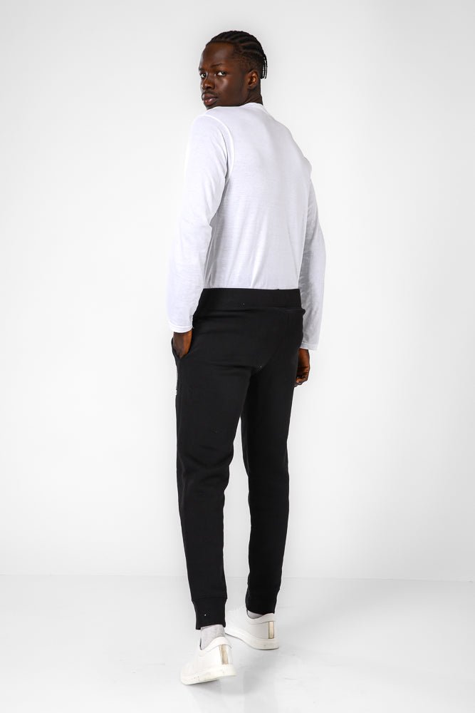 CHAMPION - מכנסיים ארוכים בצבע שחור - MASHBIR//365