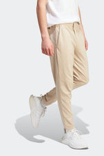 ADIDAS - מכנסיים ארוכים לגברים ESSENTIALS SINGLE JERSEY TAPERED בצבע בז' - MASHBIR//365