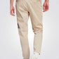 ADIDAS - מכנסיים ארוכים לגברים ESSENTIALS SINGLE JERSEY TAPERED בצבע בז' - MASHBIR//365 - 2