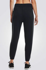 UNDER ARMOUR - מכנסיים ארוכים לנשים בצבע שחור - MASHBIR//365