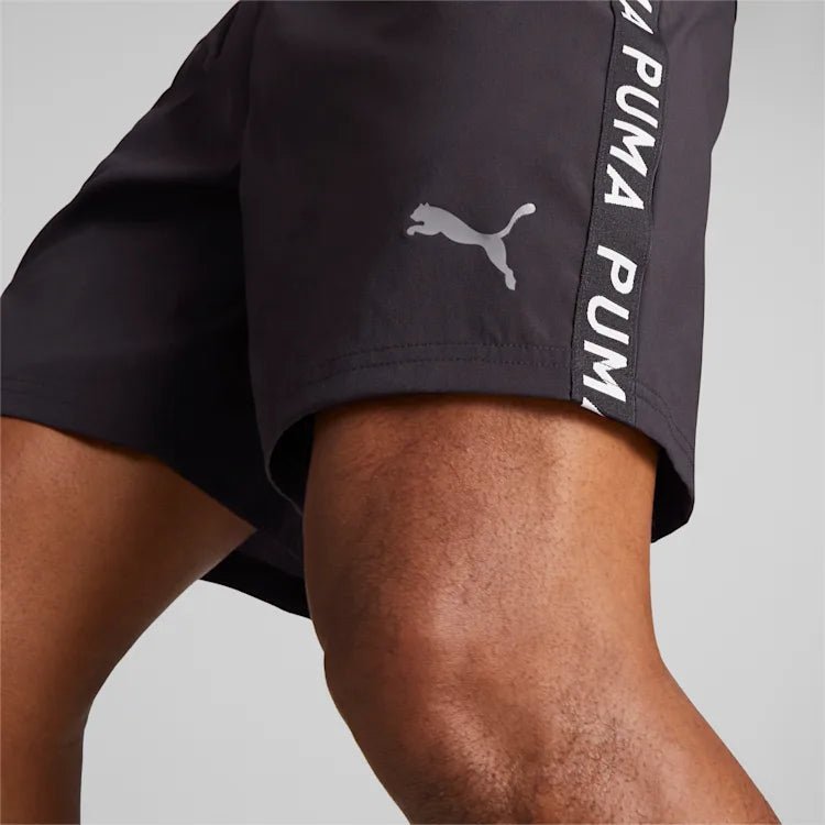 PUMA - מכנסיים קצרים FIT 7 TAPED WOV לגבר בצבע שחור - MASHBIR//365