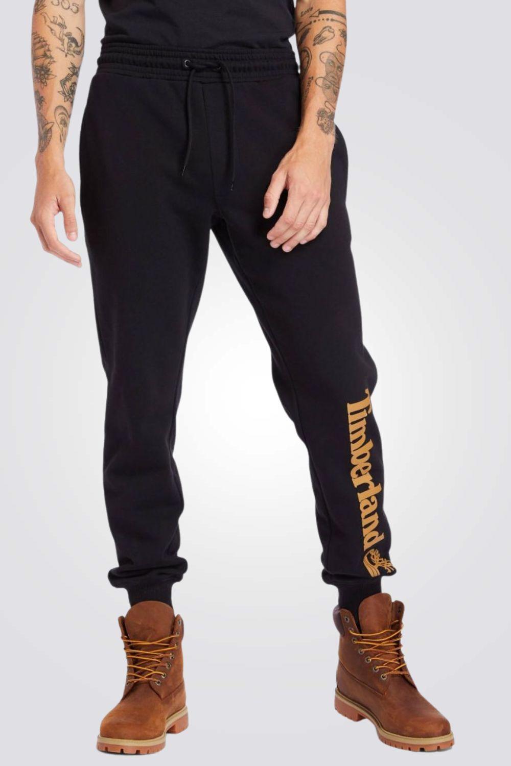 TIMBERLAND - טרנינג שחור עם הדפס לוגו על הרגל - MASHBIR//365